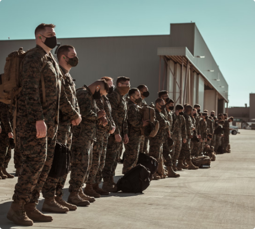 Marines in formation at the end of a flight line | Air Charter Services | Tasman Logistics Services