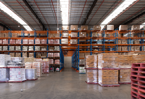 Warehouse filled with numerous pallets and boxes | Flex Warehouse Space | Tasman Logistics Services