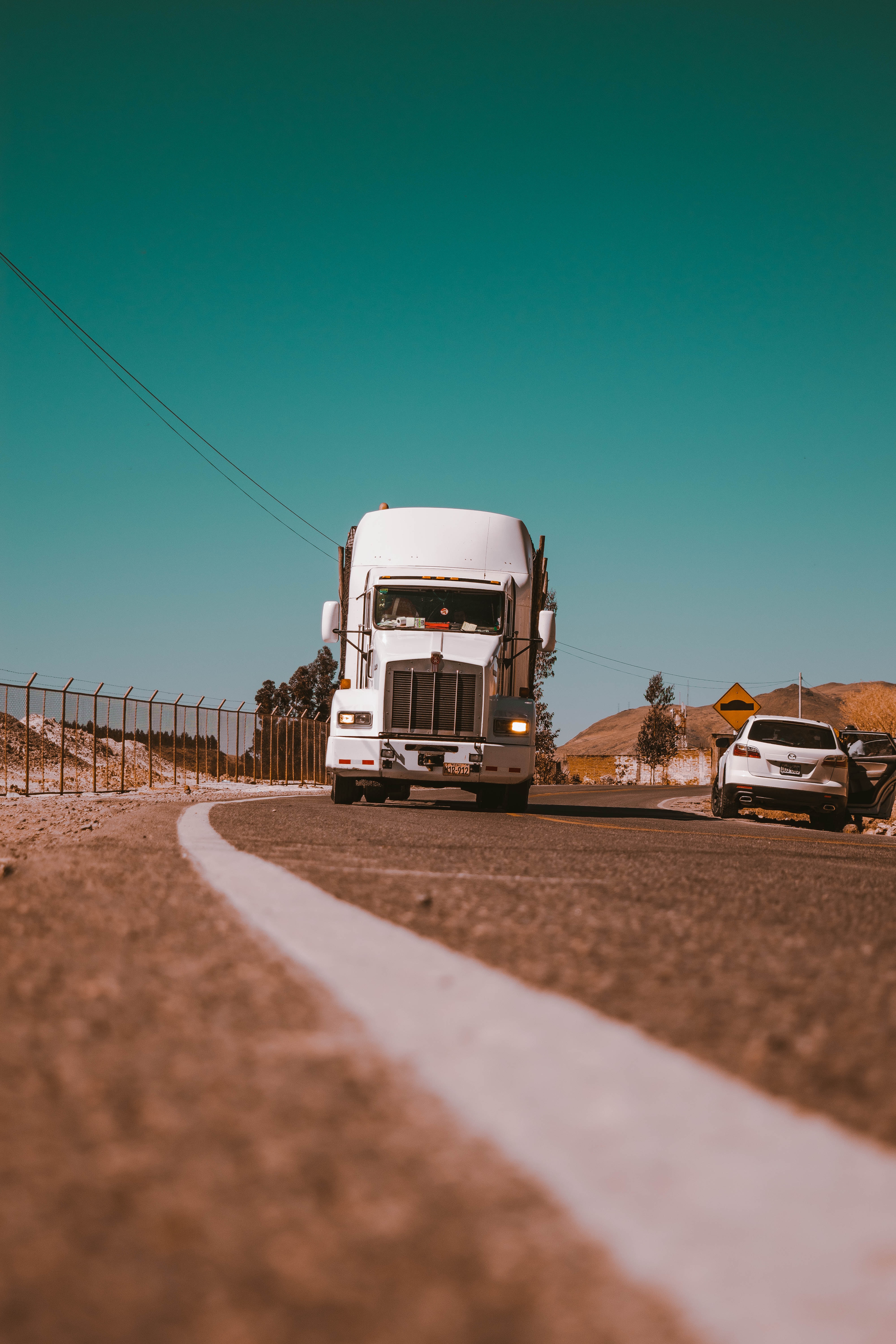 Semi truck driving down the road | Road Transport Solutions | Tasman Logistics Services